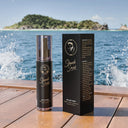 SHARK SURF Sea Salt Spray bottle and box on wooden deck with ocean view